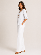 AURA | BLUSA CON BOTONES Y VOLANTES